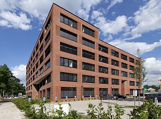 In perspective, extremely acute-angled corner brick house with fe