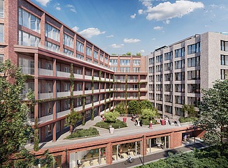 Here you can see a photo of an office building, an attractive red brick façade and blue sky