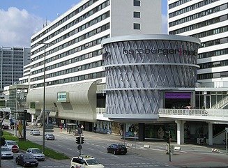 Futuristic curved façade, round porch with latticework and Hamburger Meile lettering