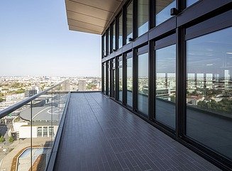 High-rise tower with stepped window design and stepped top floor