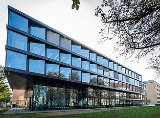 Corner house on a large square with offset window façade