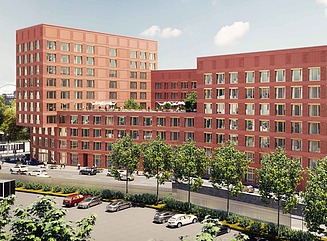 Kontortårn med rød murstensfacade og mange firkantede vinduer.