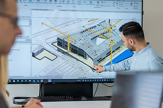 Model Contract models Person explains a 3D model in front of a screen