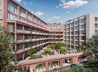 Her kan du se et foto af en kontorbygning med en flot rød murstensfacade og blå himmel